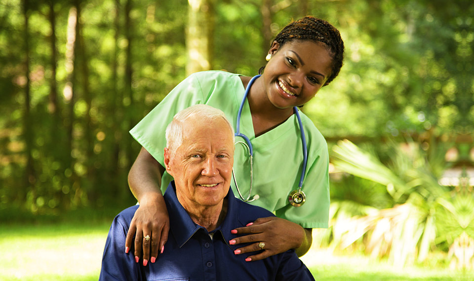 nurse smiling with her senior patient