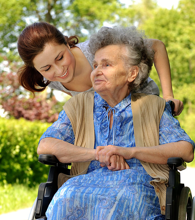 young lady accompanying a senior woman on a wheelchair