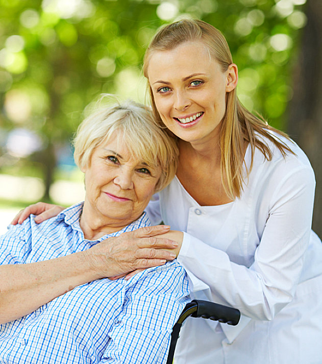 caregiver and her senior patient smiling